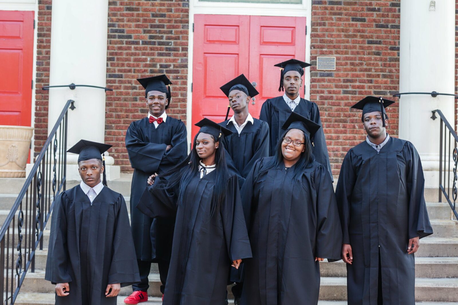 Amid cheers and applause, a group of African American students proudly don their graduation caps and gowns at Triumph School, celebrating their academic achievements and the bright futures that lie ahead.